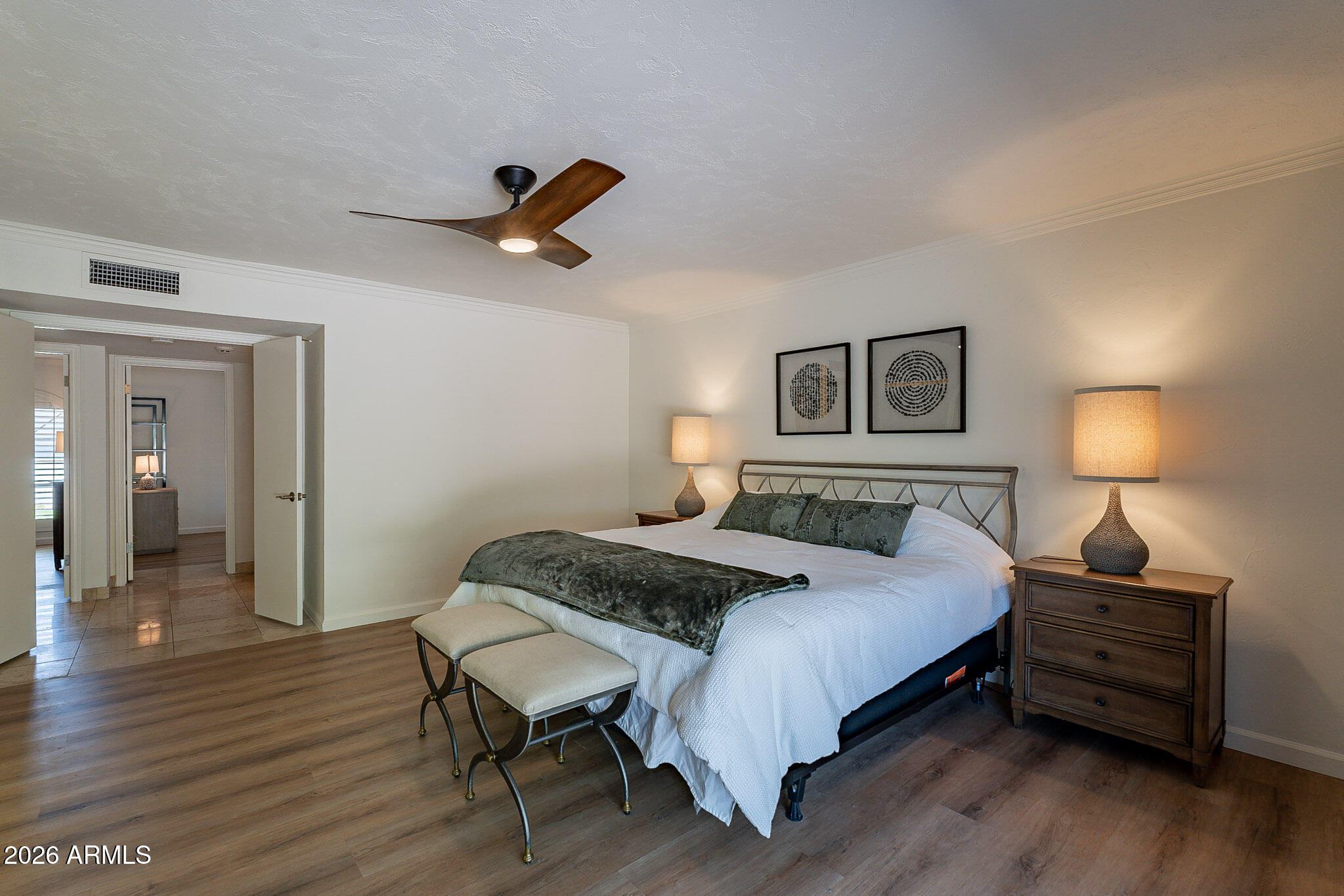 4226 East North Lane Phoenix, AZ 85028 - Photo 24 of 43 a bedroom with a bed and wooden floor
