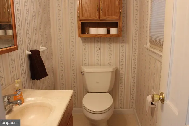 a bathroom with a toilet and a sink
