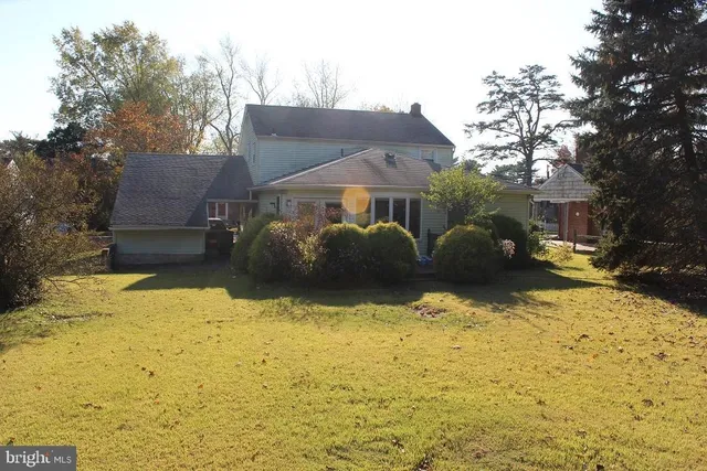a front view of house with yard covered with snow in front of house