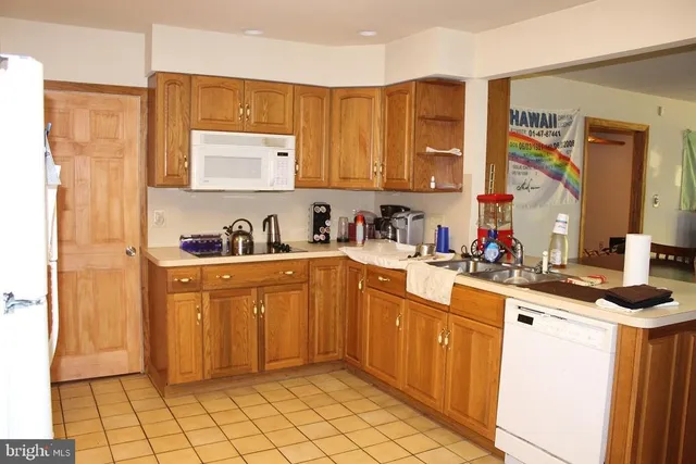 a kitchen with a sink cabinets and window