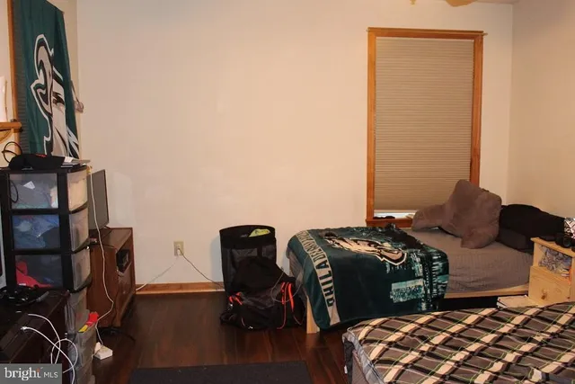 a bedroom with bed and a closet