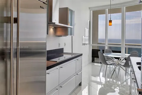 a kitchen with a sink cabinets and window