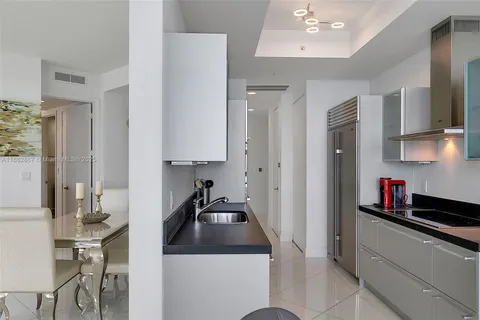 a view of room with wooden floor and furniture