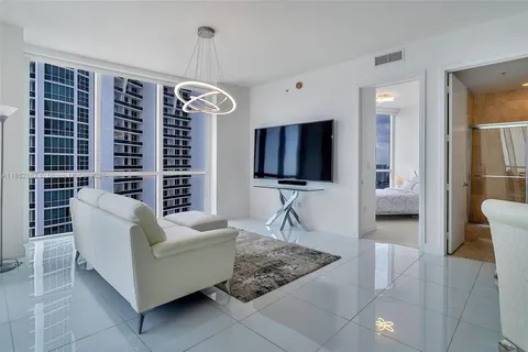 a living room with furniture and a rug