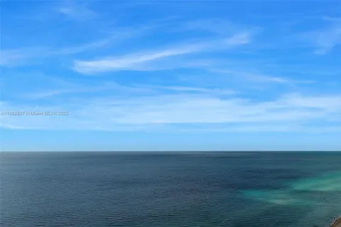 a view of a swimming pool with a yard