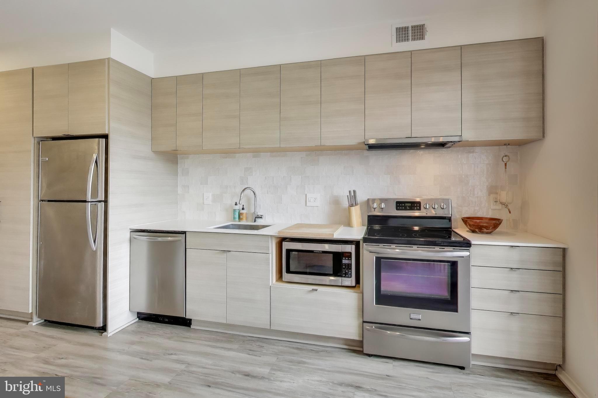 1550 11th Street Northwest, Unit 203 Washington, DC 20005 - Photo 15 of 35 Sleek modern kitchen with stylish finishes.
