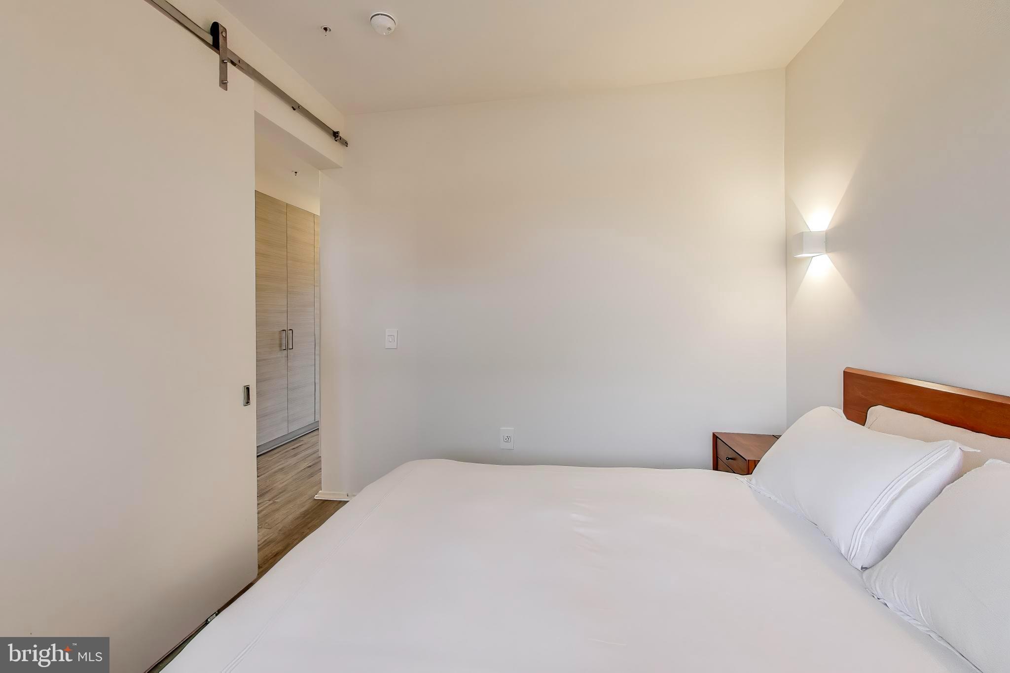 1550 11th Street Northwest, Unit 203 Washington, DC 20005 - Photo 18 of 35 Serene bedroom with modern design elements.