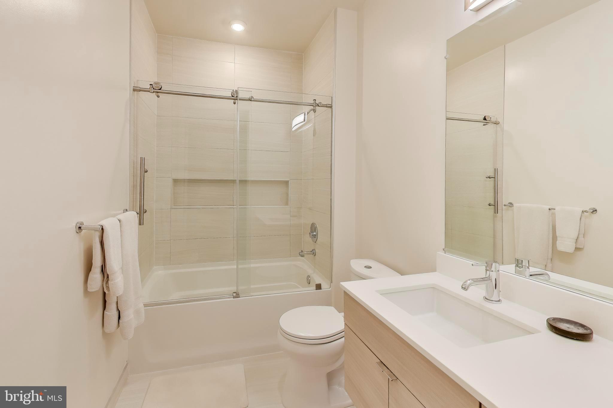 1550 11th Street Northwest, Unit 203 Washington, DC 20005 - Photo 19 of 35 Sleek modern bathroom with elegant finishes.