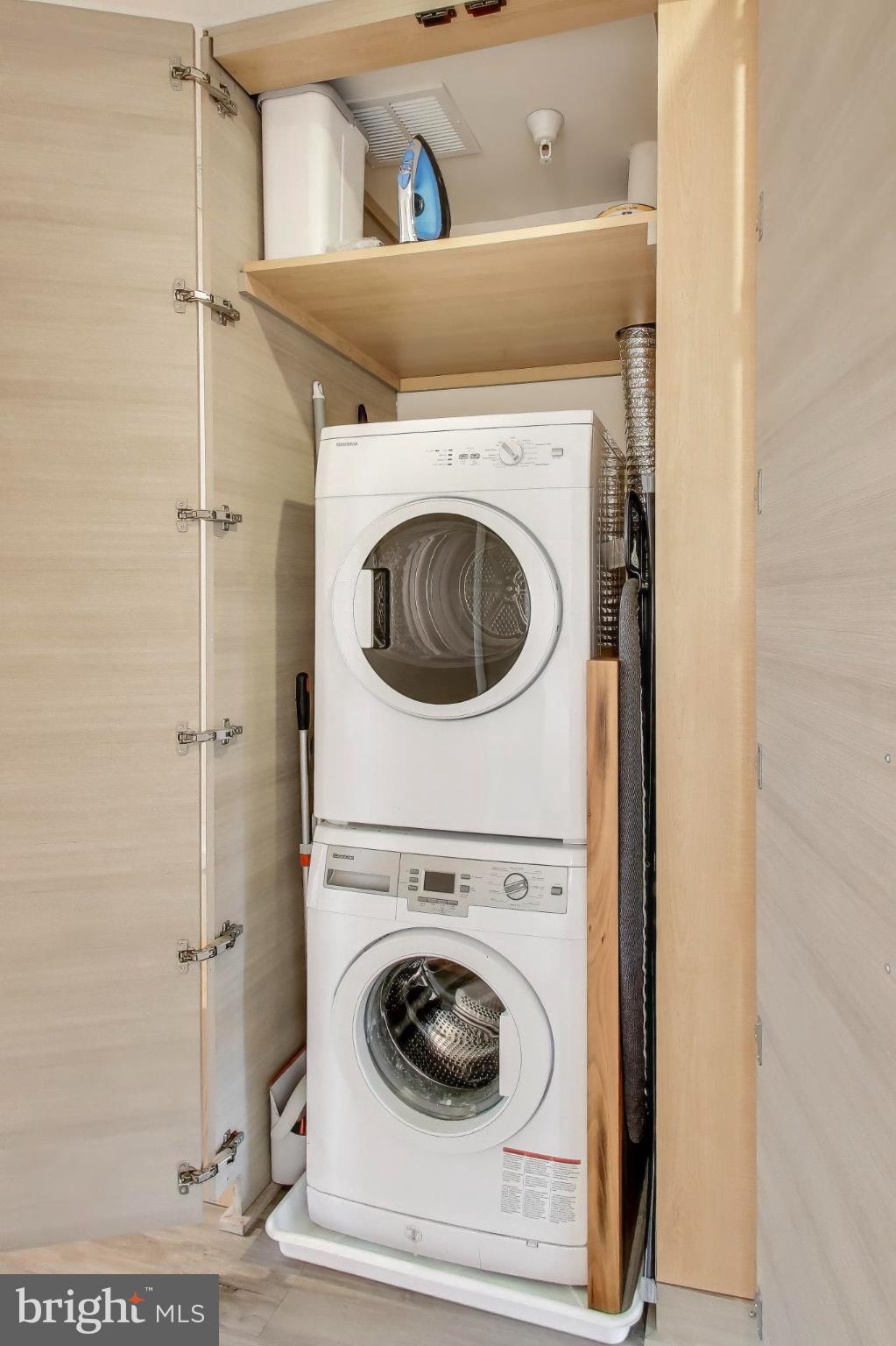 1550 11th Street Northwest, Unit 203 Washington, DC 20005 - Photo 20 of 35 Compact laundry space with modern appliances.