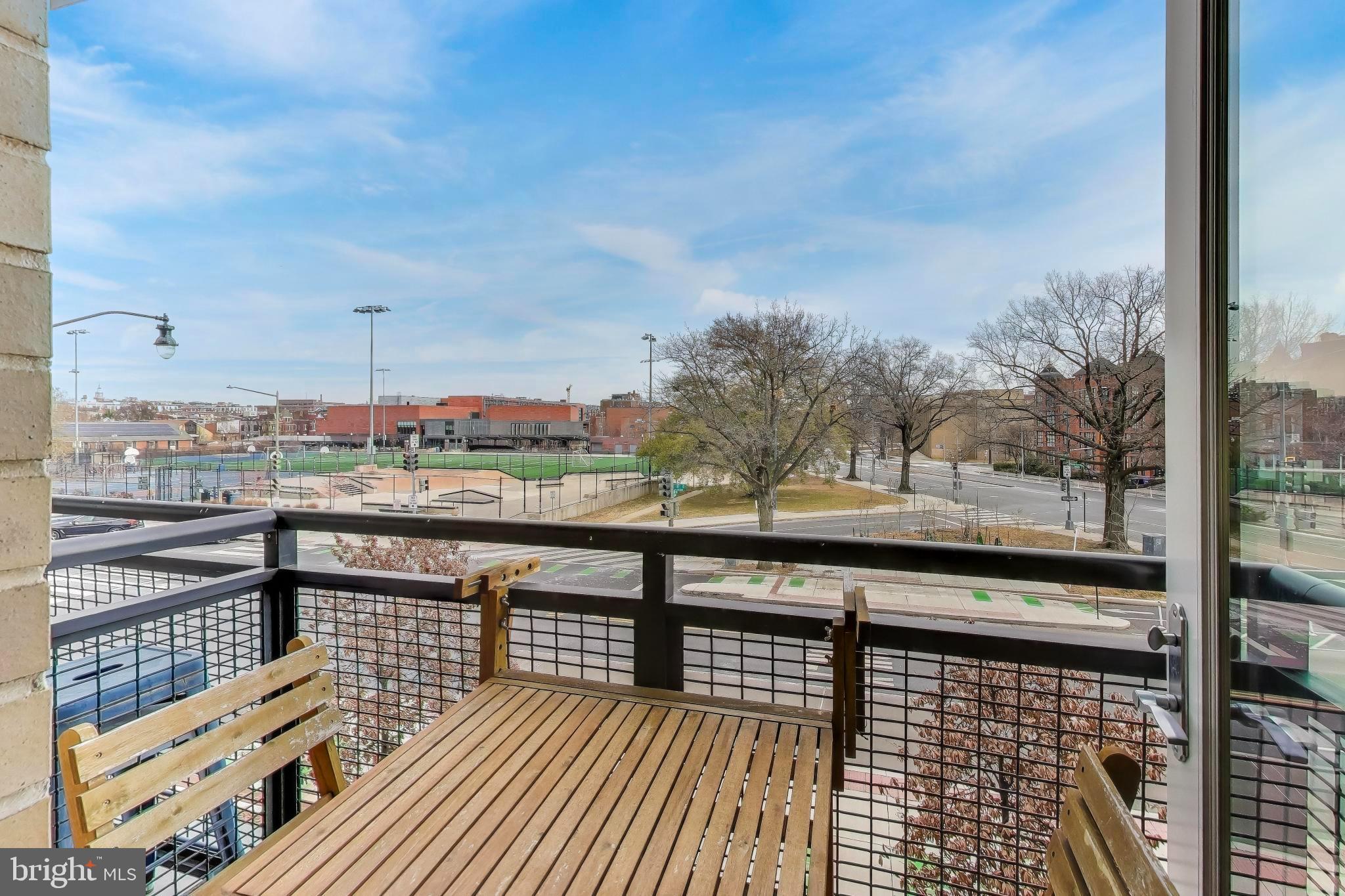 1550 11th Street Northwest, Unit 203 Washington, DC 20005 - Photo 21 of 35 Charming balcony with vibrant park views.