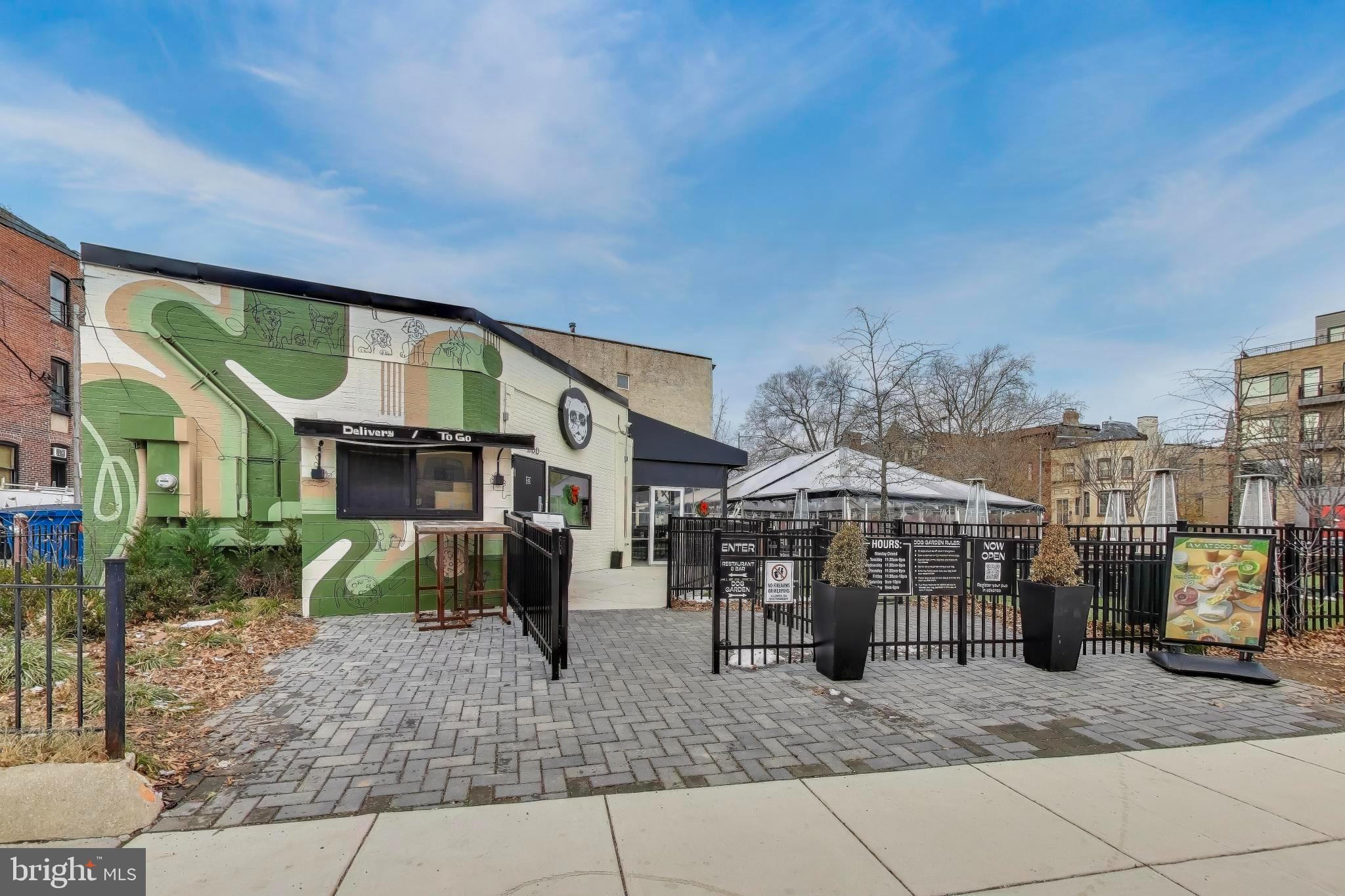 1550 11th Street Northwest, Unit 203 Washington, DC 20005 - Photo 32 of 35 Charming eatery with vibrant mural and patio.