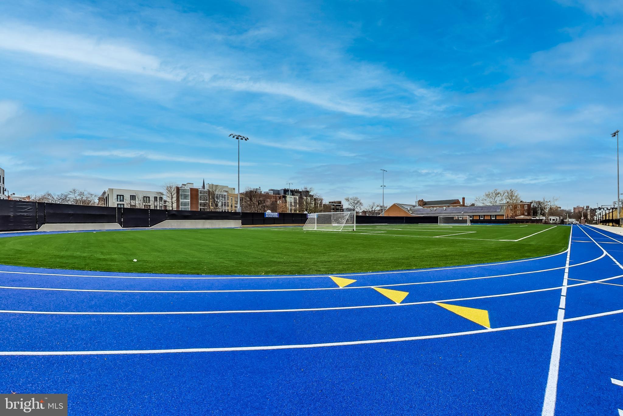 1550 11th Street Northwest, Unit 203 Washington, DC 20005 - Photo 34 of 35 Vibrant track and field under a clear sky.