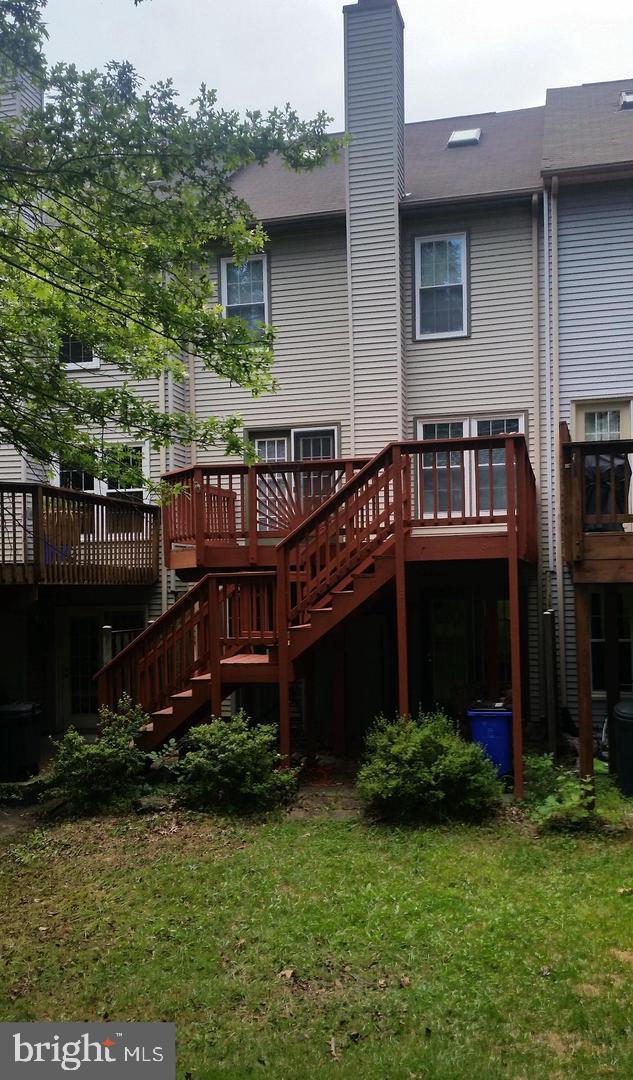 4713 Columbia Road Ellicott City, MD 21042 - Photo 11 of 39 Charming backyard with inviting deck space.