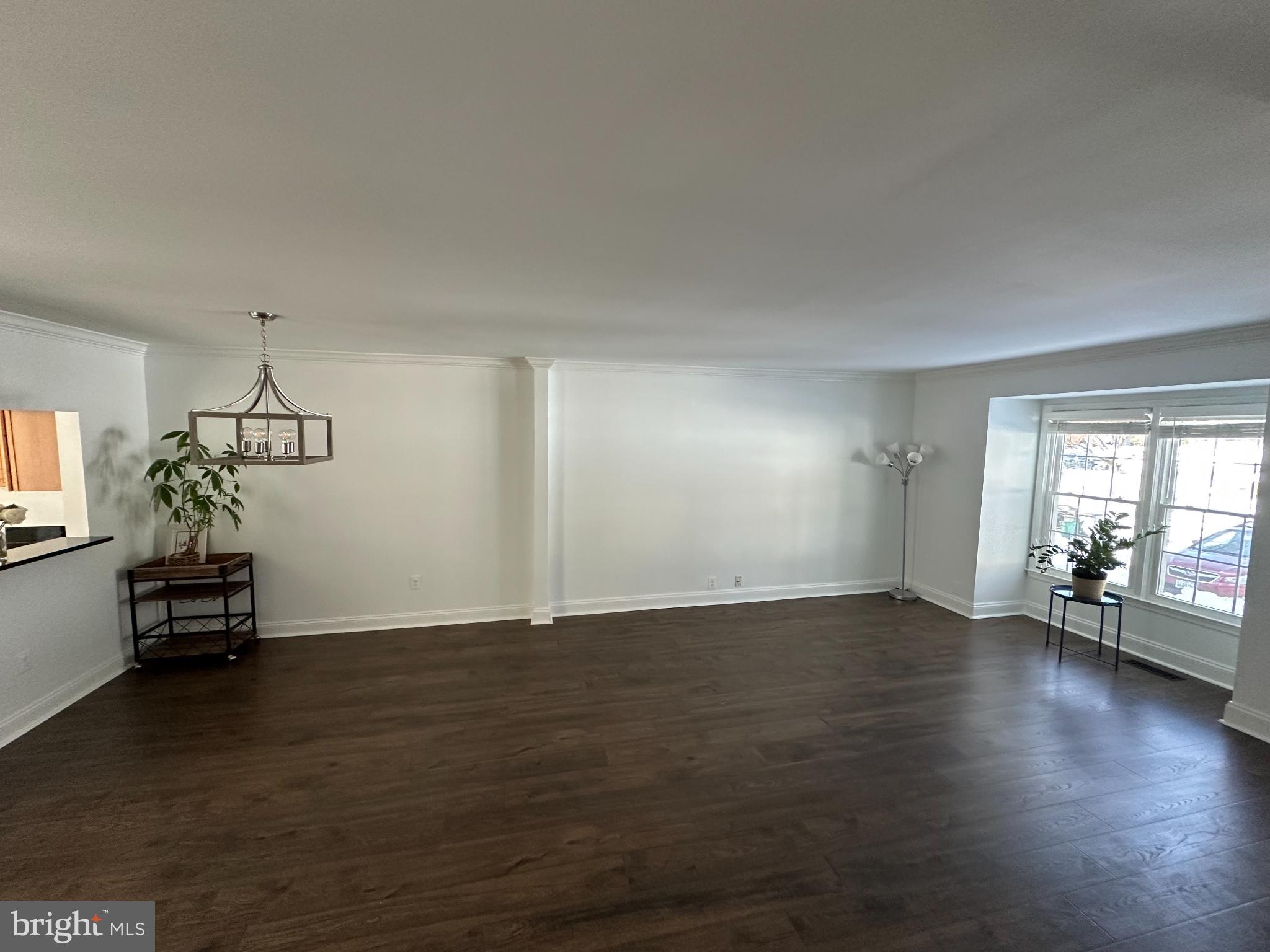 4713 Columbia Road Ellicott City, MD 21042 - Photo 13 of 39 Spacious, sunlit living area on the main level.