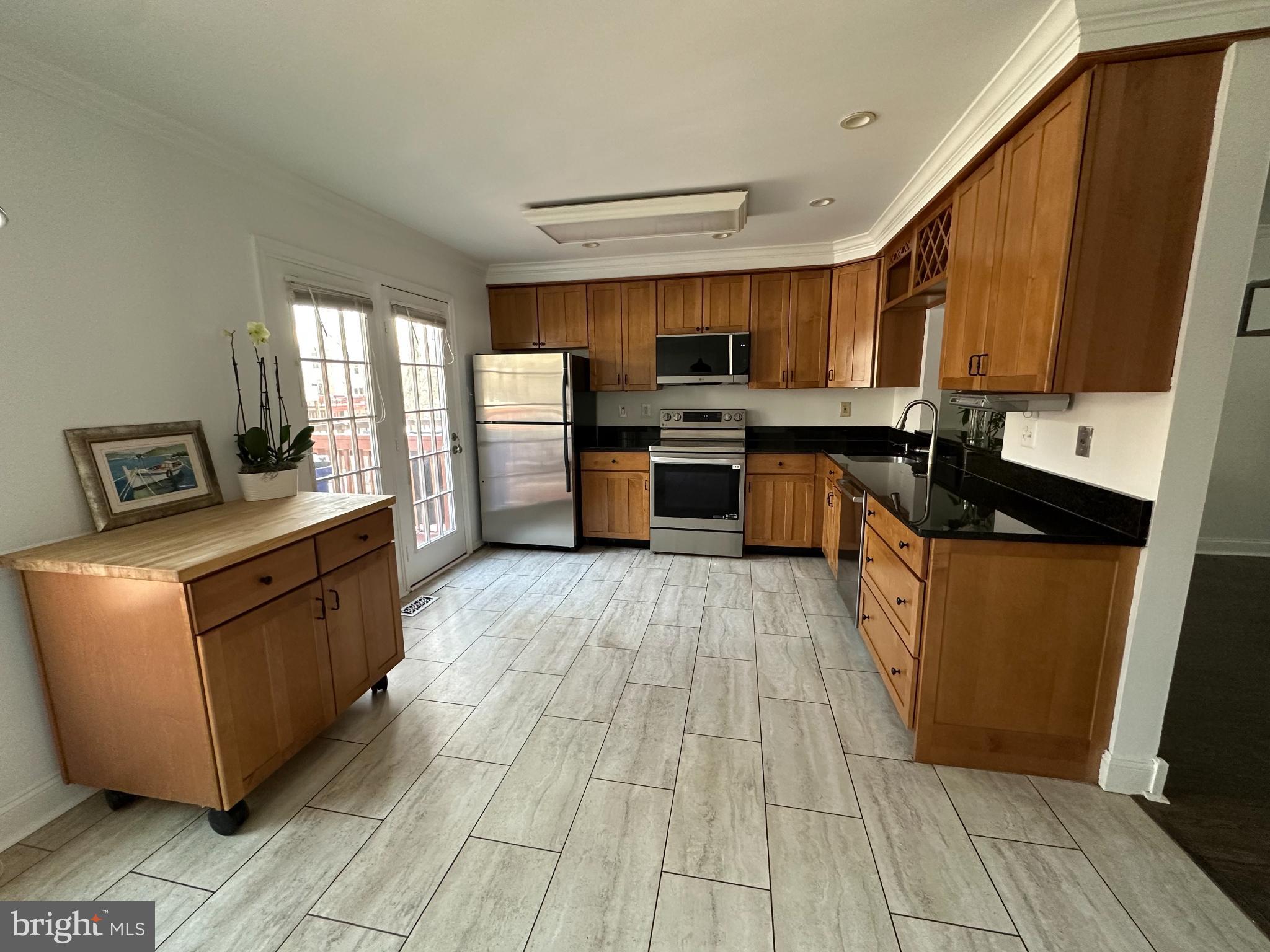 4713 Columbia Road Ellicott City, MD 21042 - Photo 5 of 39 Modern kitchen with sleek cabinetry.