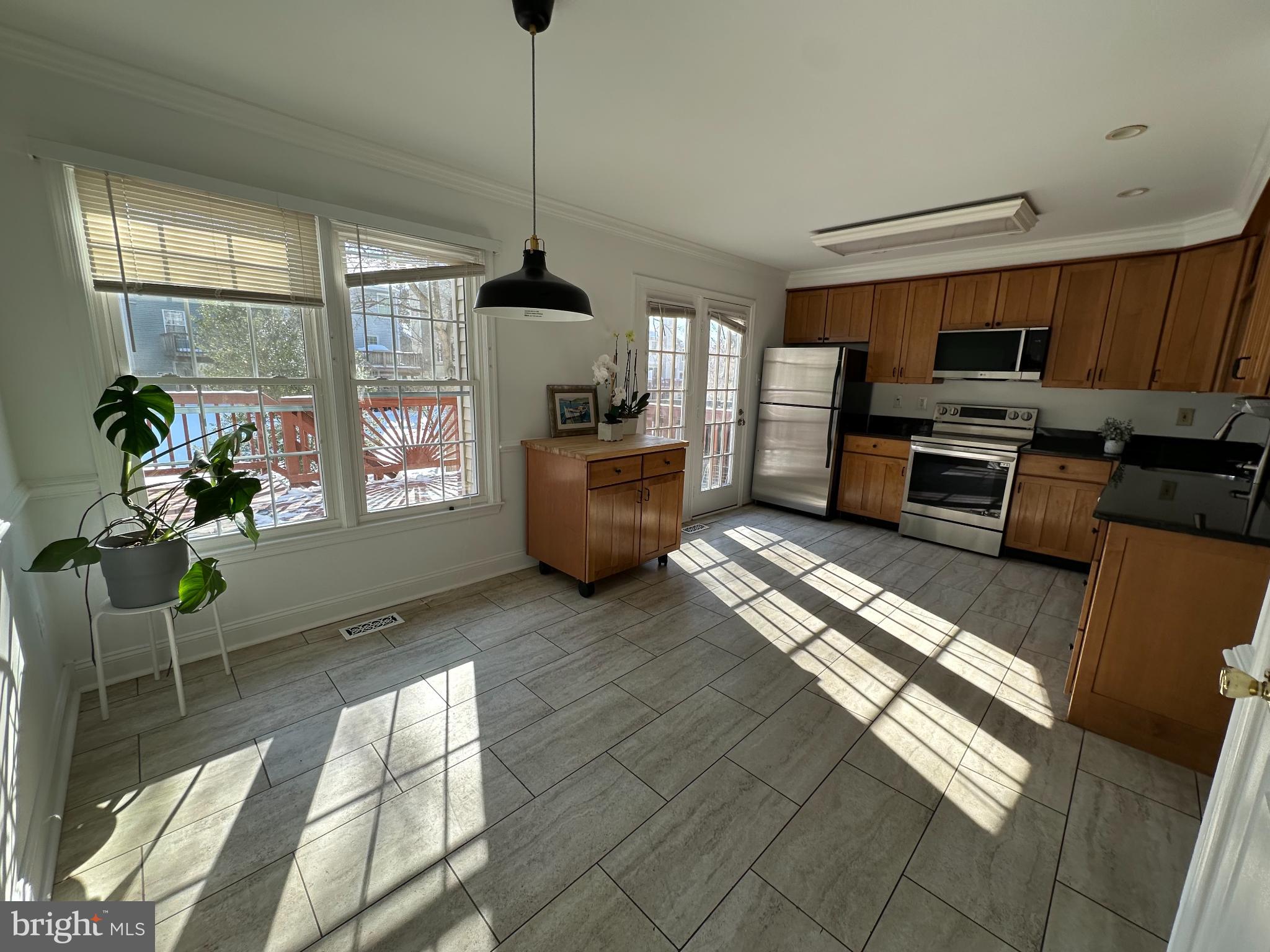 4713 Columbia Road Ellicott City, MD 21042 - Photo 9 of 39 Bright and airy kitchen with sunlit charm.