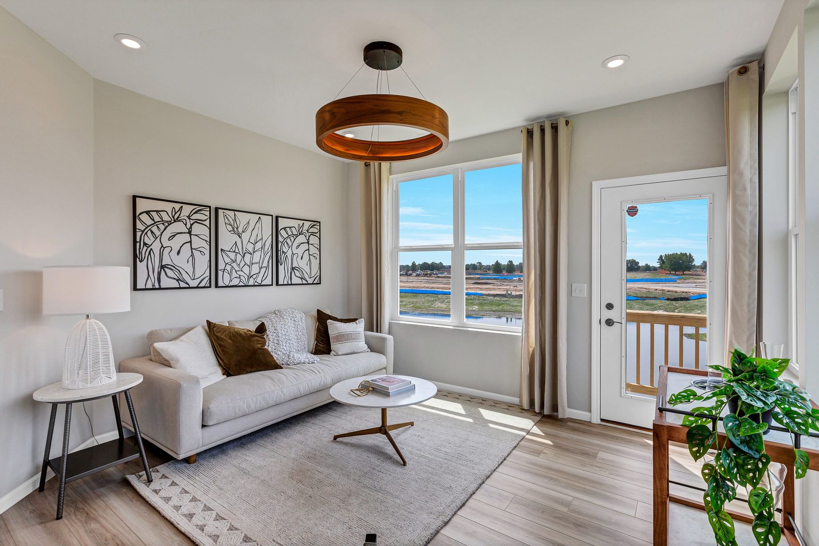 2798 Spring Circle South Lindenhurst, IL 60046 - Photo 12 of 16 a living room with furniture and a large window