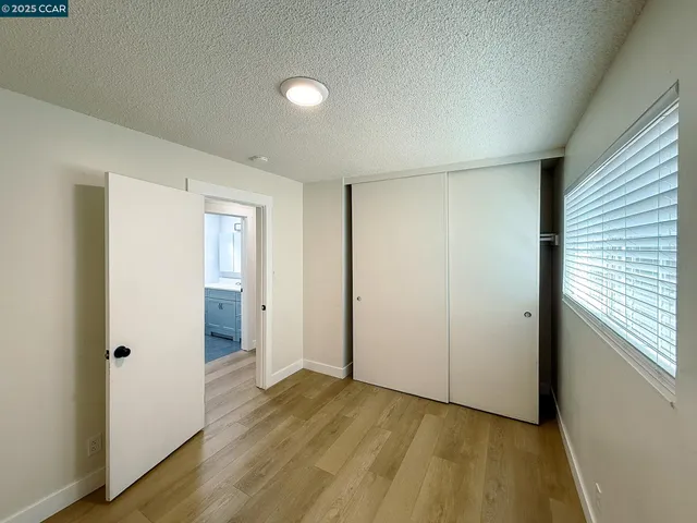 a view of hallway with wooden floor