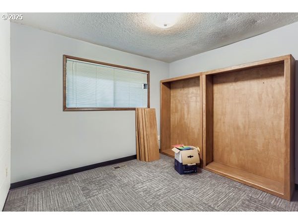 24353 South Ridge Road Beavercreek, OR 97004 - Photo 21 of 33 a view of empty room with a window
