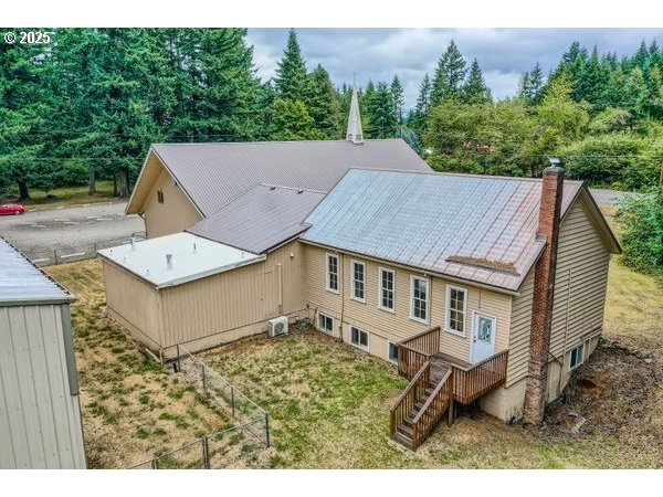 24353 South Ridge Road Beavercreek, OR 97004 - Photo 5 of 33 a view of a house with a backyard and porch