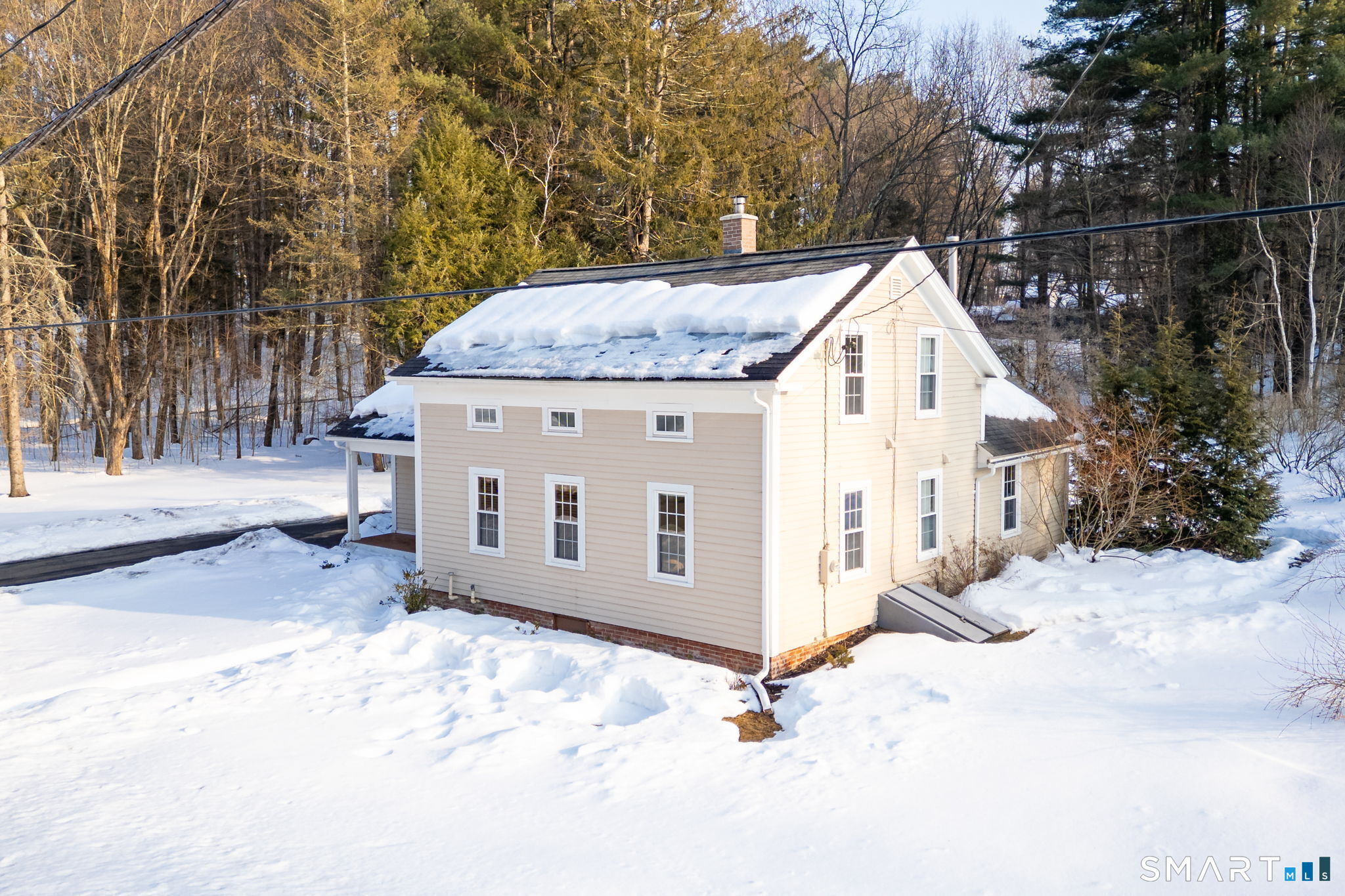 10 Bailey Road Enfield, CT 06082 - Photo 13 of 39 a view of a white house with a yard covered in snow