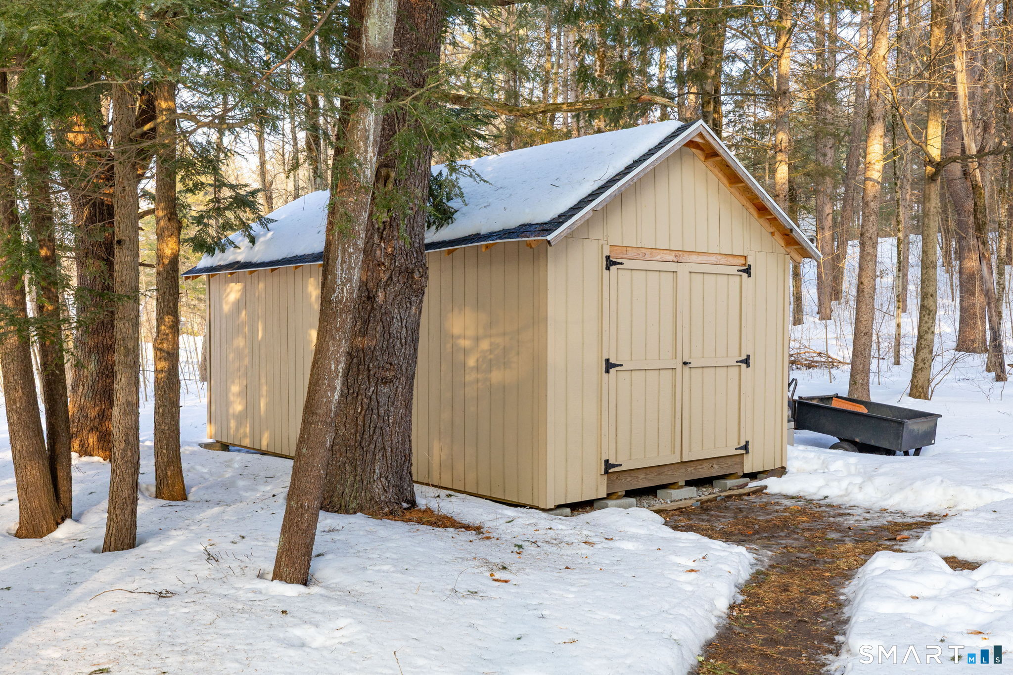 10 Bailey Road Enfield, CT 06082 - Photo 20 of 39 a view of a house with wooden fence and large trees