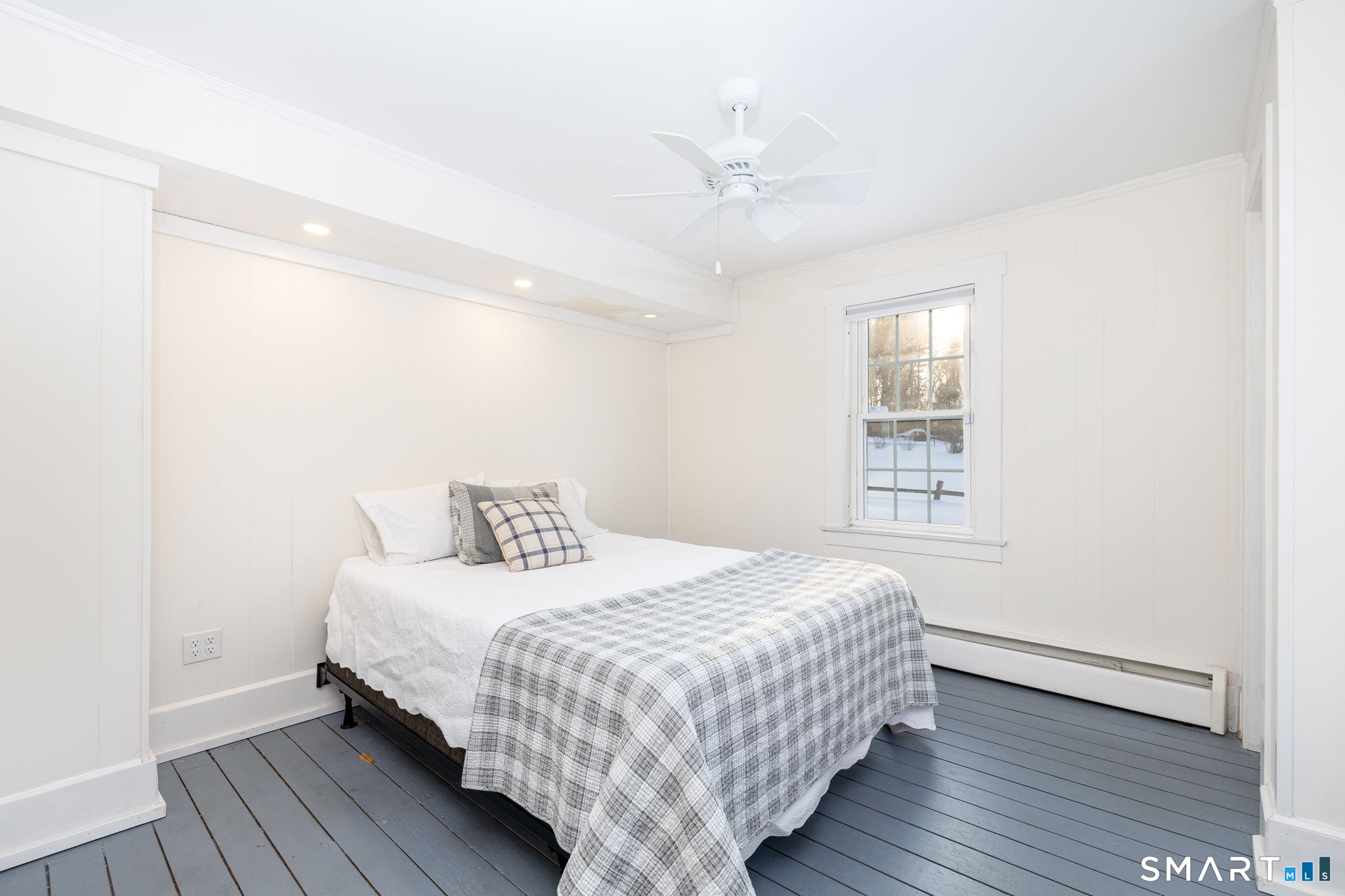 10 Bailey Road Enfield, CT 06082 - Photo 26 of 39 a bedroom with a bed and wooden floor