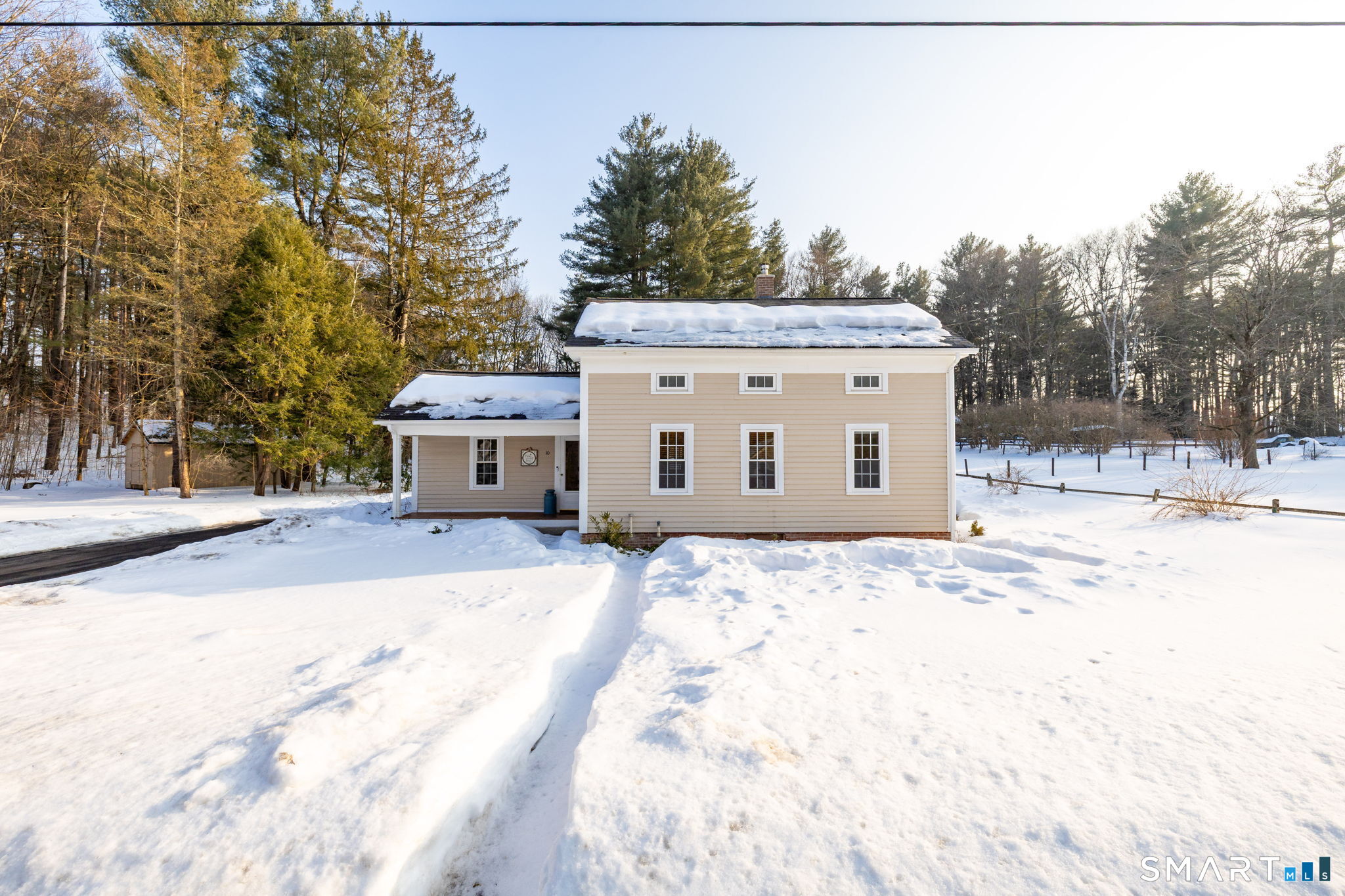 10 Bailey Road Enfield, CT 06082 - Photo 3 of 39 a view of a house with a yard covered in snow