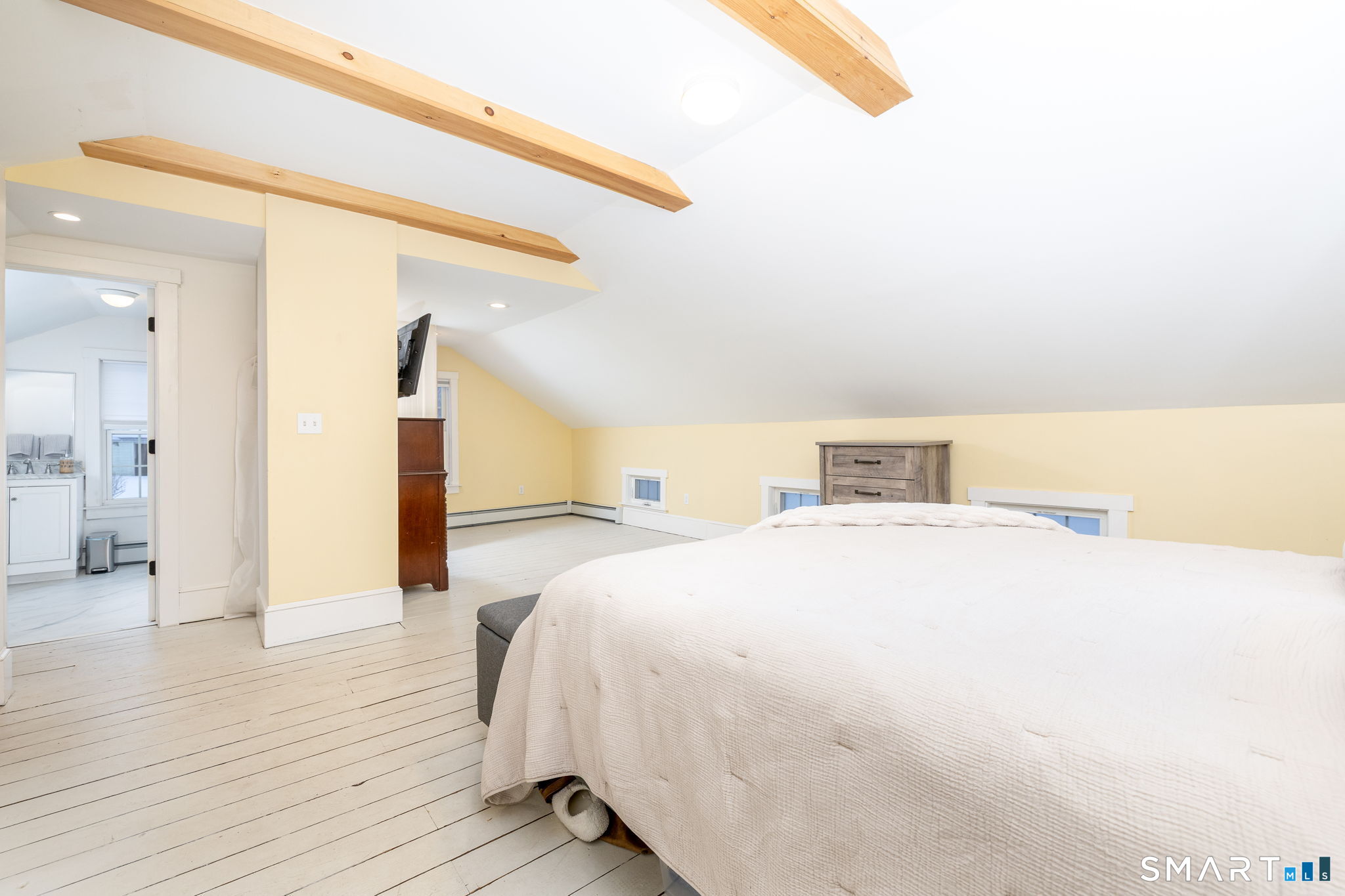 10 Bailey Road Enfield, CT 06082 - Photo 31 of 39 a spacious bedroom with a bed and wooden floor