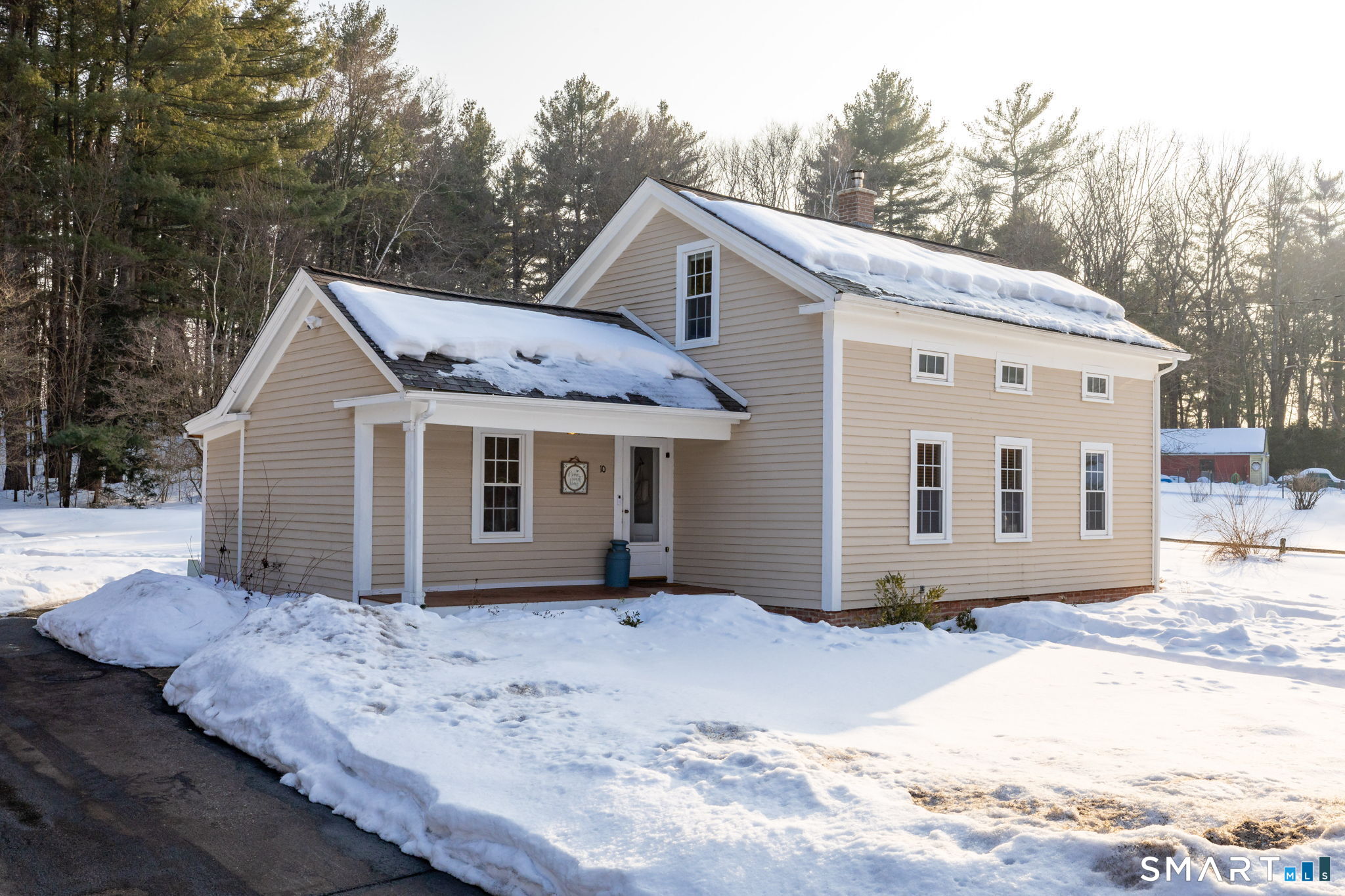 10 Bailey Road Enfield, CT 06082 - Photo 4 of 39 a view of a house with a yard covered in snow