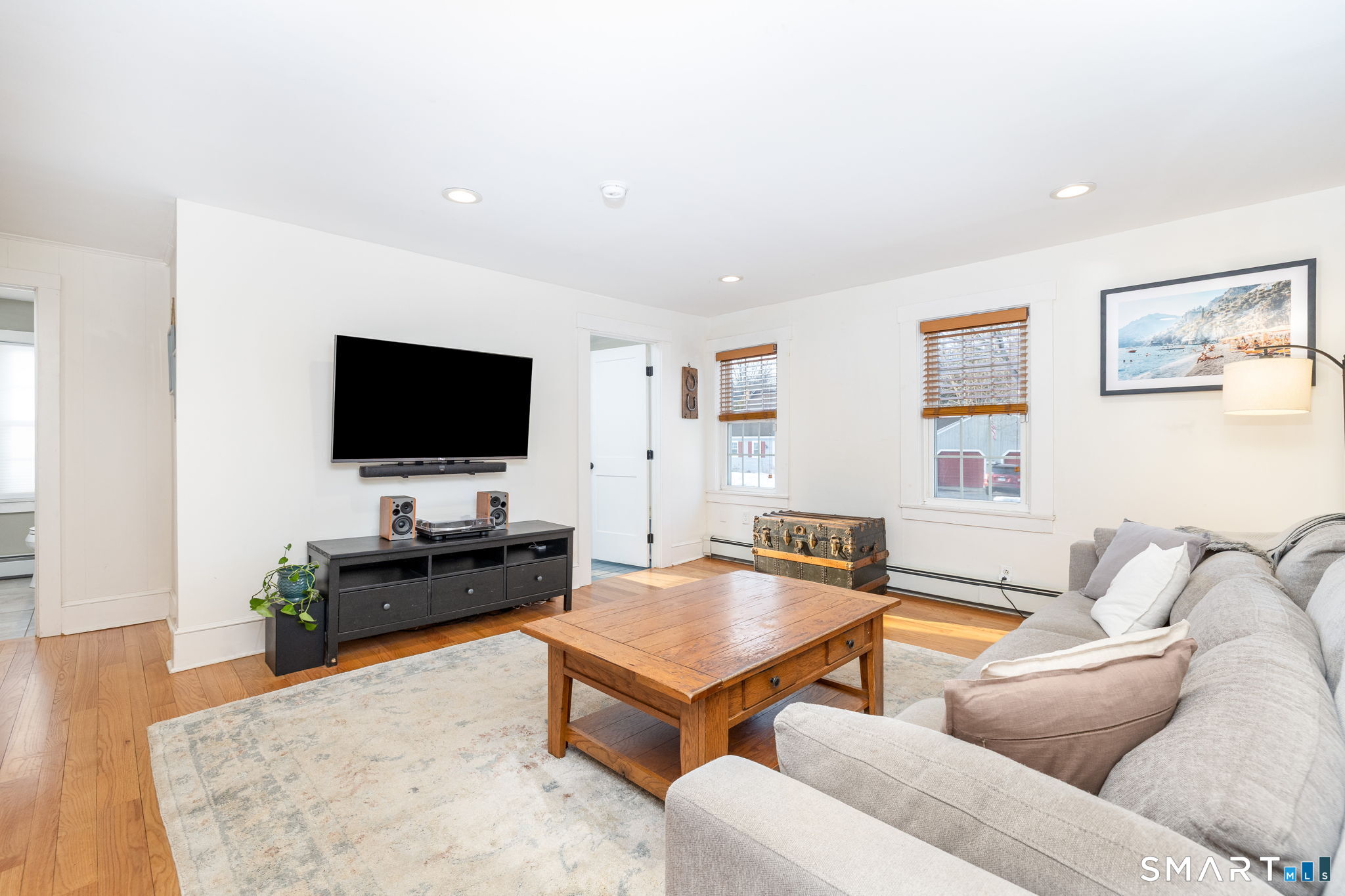 10 Bailey Road Enfield, CT 06082 - Photo 5 of 39 a living room with furniture and a flat screen tv