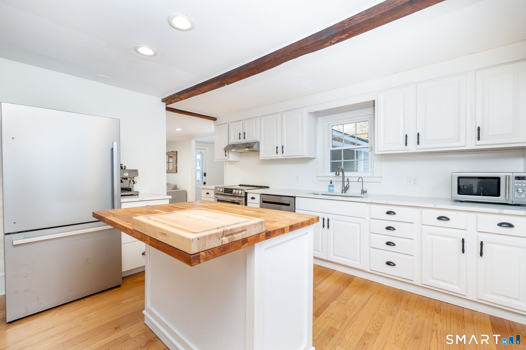 10 Bailey Road Enfield, CT 06082 - Photo 9 of 39 a kitchen with stainless steel appliances granite countertop a sink stove and refrigerator