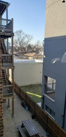 a view of a terrace with wooden floor and outdoor seating