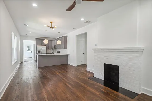 a view of kitchen and kitchen with sink