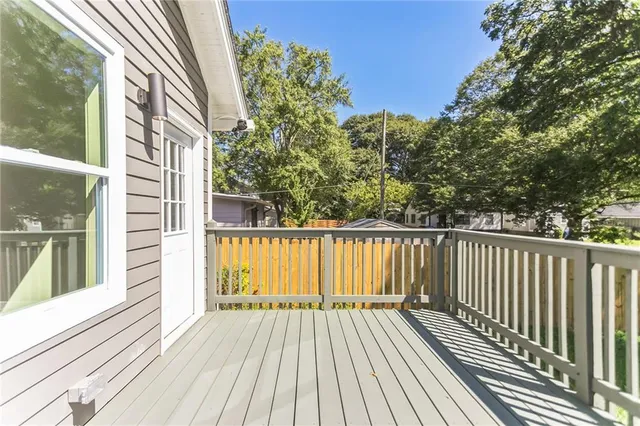 a view of balcony with wooden floor