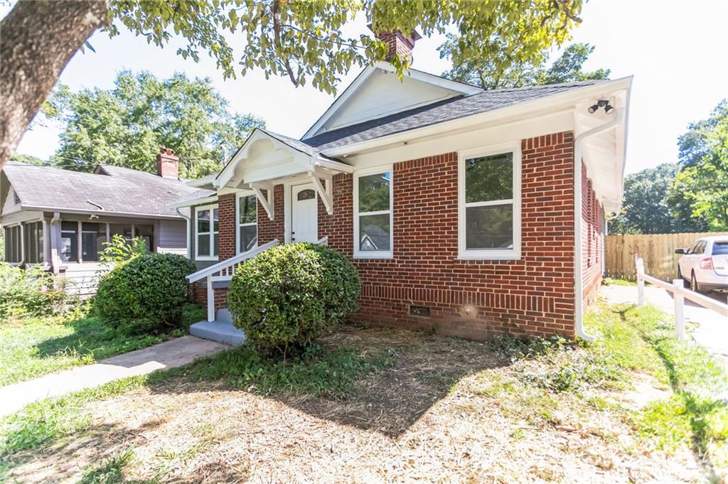 1252 Epworth Street Southwest Atlanta, GA 30310 - Photo 2 of 19 a view of a house with a yard and sitting area