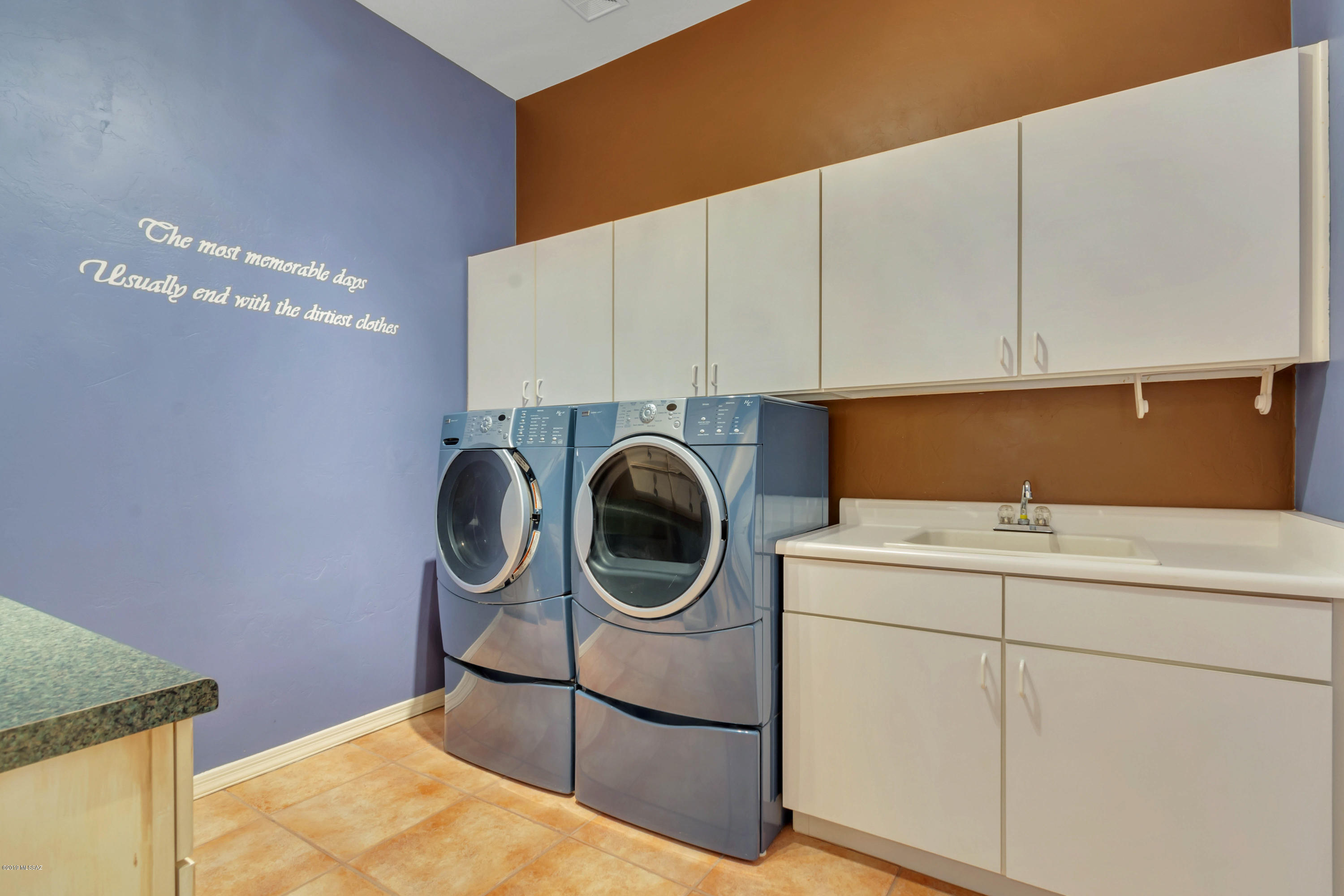 12682 North Spirit Mountain Road Oro Valley, AZ 85755 - Photo 14 of 40 a utility room with dryer and washer