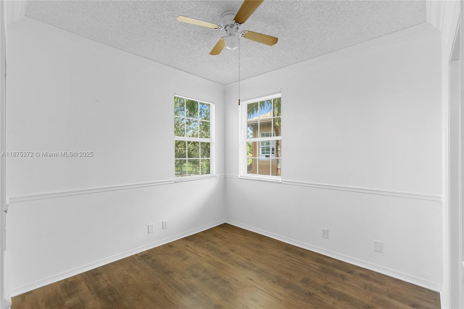 1440 Coronado Road, Unit 138 Weston, FL 33327 - Photo 18 of 38 an empty room with windows and fan