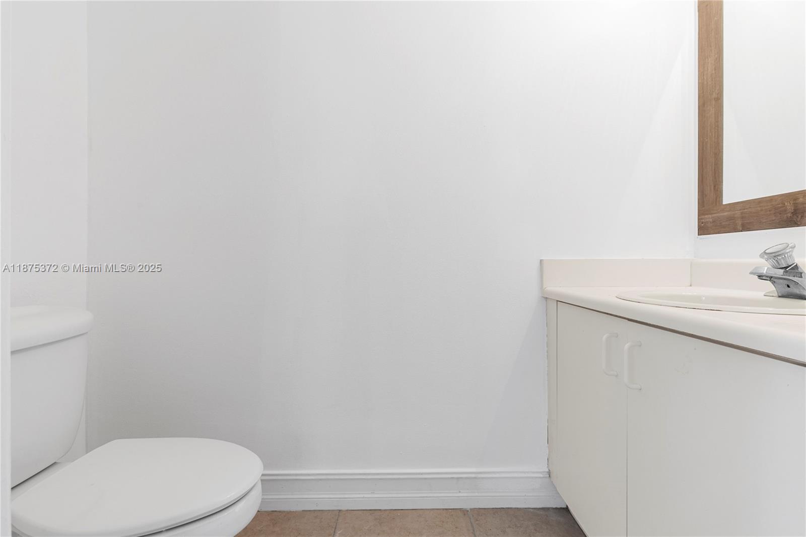 1440 Coronado Road, Unit 138 Weston, FL 33327 - Photo 19 of 38 a bathroom with a sink a toilet and vanity