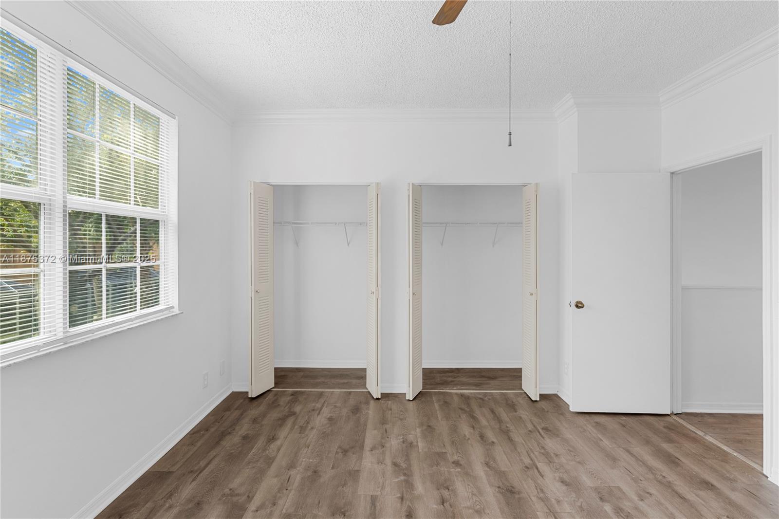 1440 Coronado Road, Unit 138 Weston, FL 33327 - Photo 25 of 38 a view of empty room with wooden floor and fan