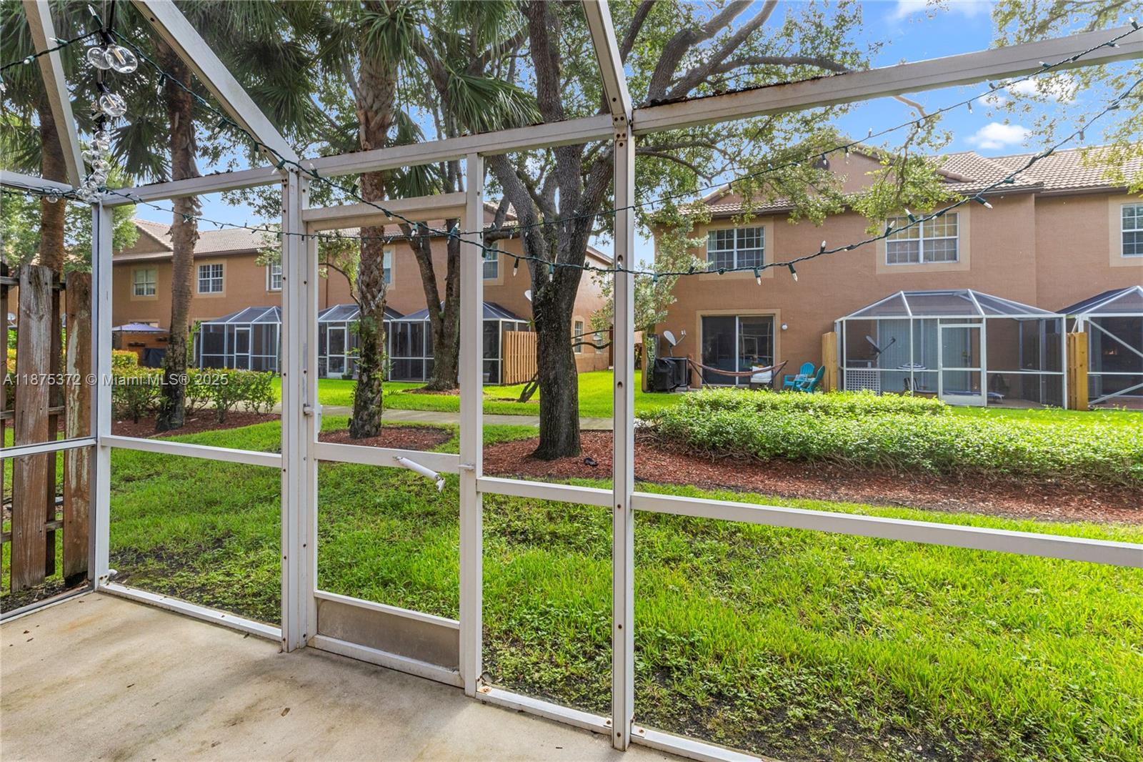 1440 Coronado Road, Unit 138 Weston, FL 33327 - Photo 30 of 38 a view of a house with a yard and plants