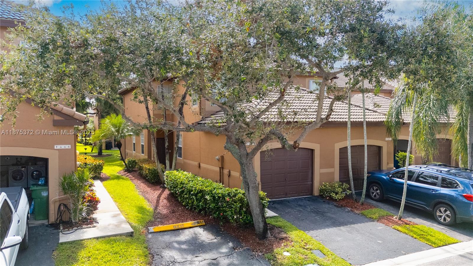 1440 Coronado Road, Unit 138 Weston, FL 33327 - Photo 3 of 38 a view of a house with swimming pool and sitting area