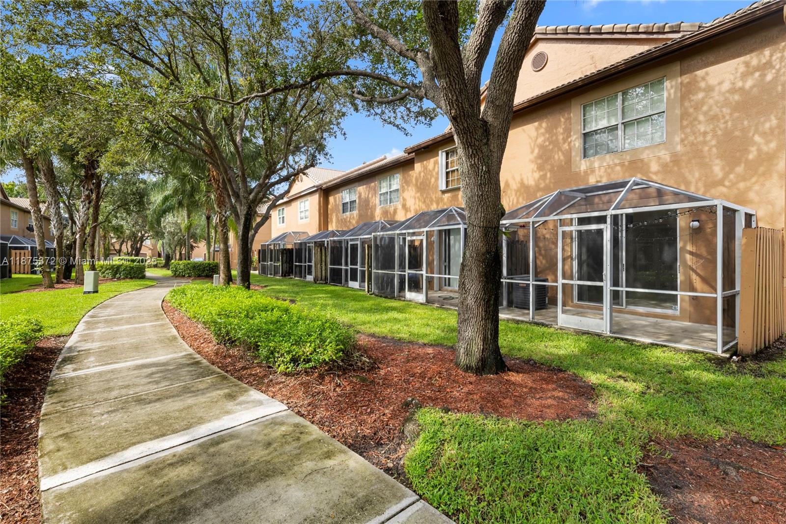 1440 Coronado Road, Unit 138 Weston, FL 33327 - Photo 32 of 38 a view of a house with a yard