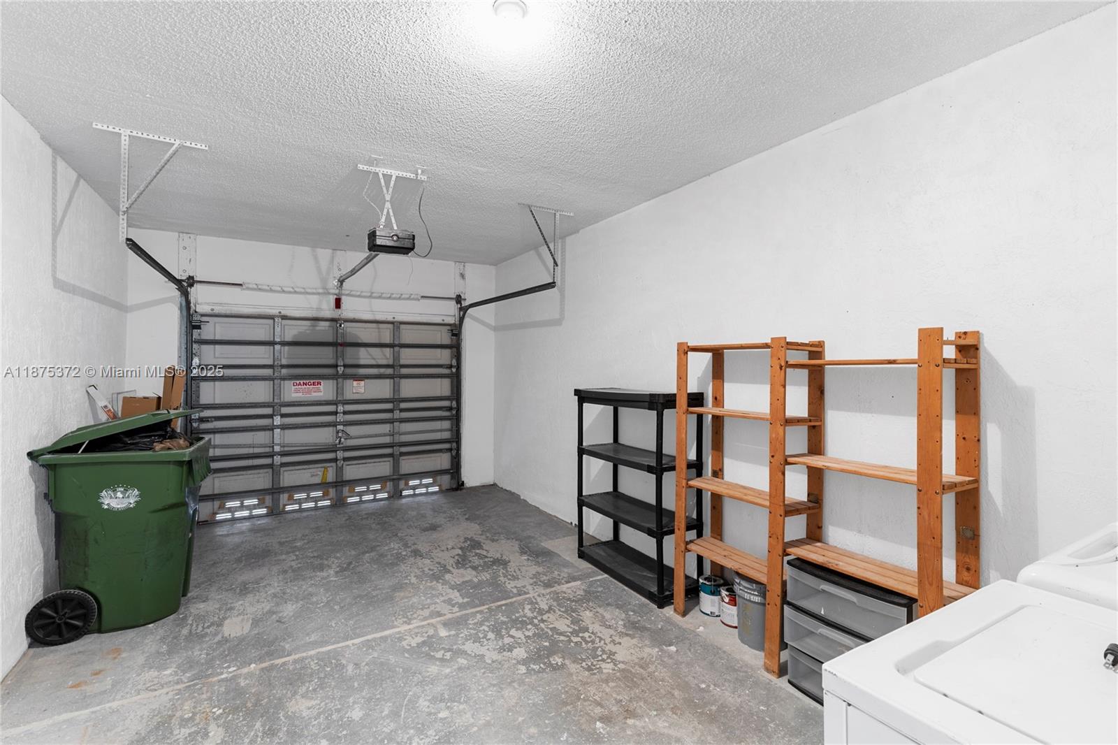 1440 Coronado Road, Unit 138 Weston, FL 33327 - Photo 37 of 38 a view of a room with racks on the wall