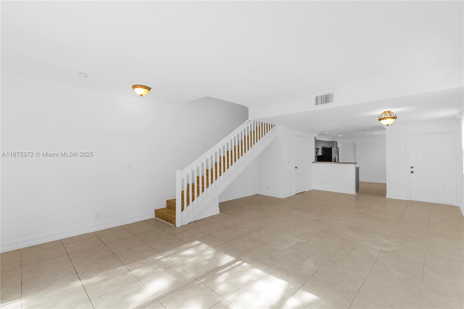1440 Coronado Road, Unit 138 Weston, FL 33327 - Photo 6 of 38 a view of an empty room with stairs
