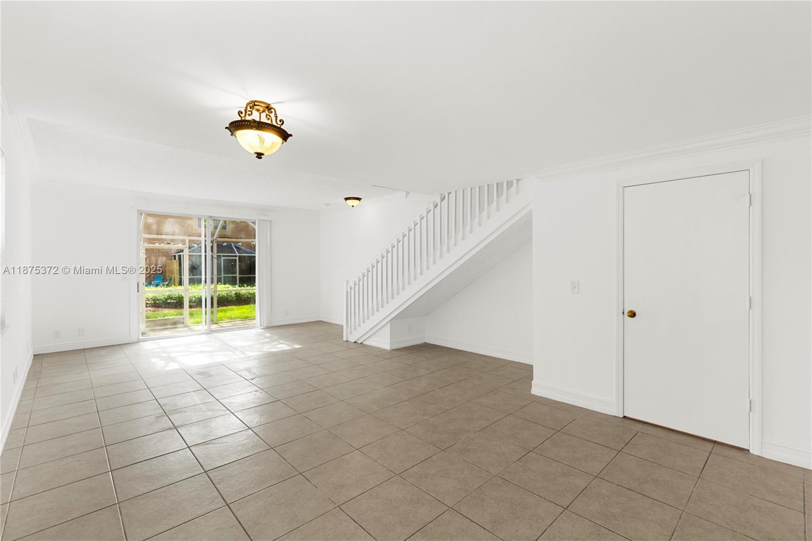 1440 Coronado Road, Unit 138 Weston, FL 33327 - Photo 7 of 38 a view of an empty room with a window