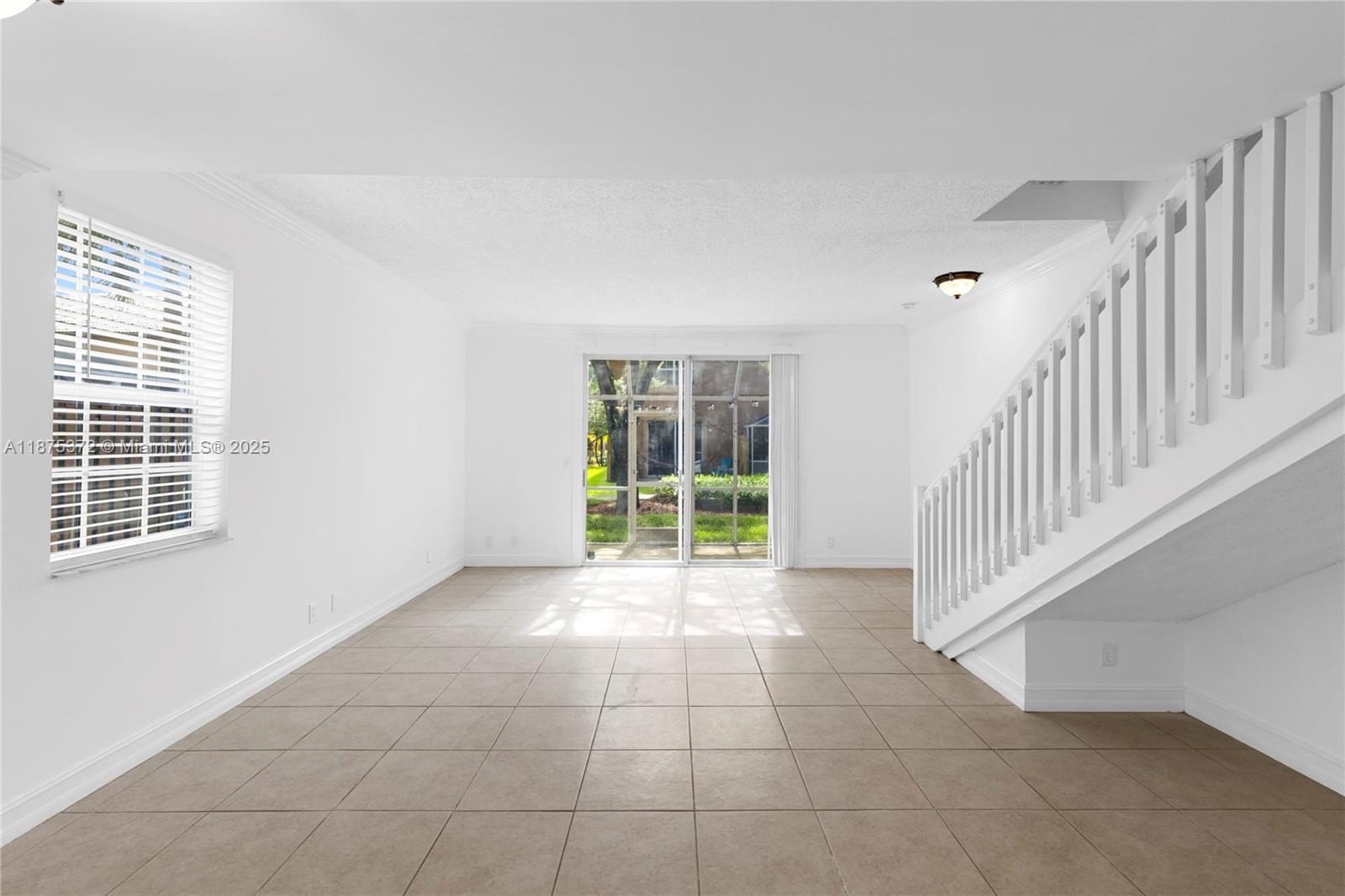 1440 Coronado Road, Unit 138 Weston, FL 33327 - Photo 8 of 38 a view of an empty room with a window