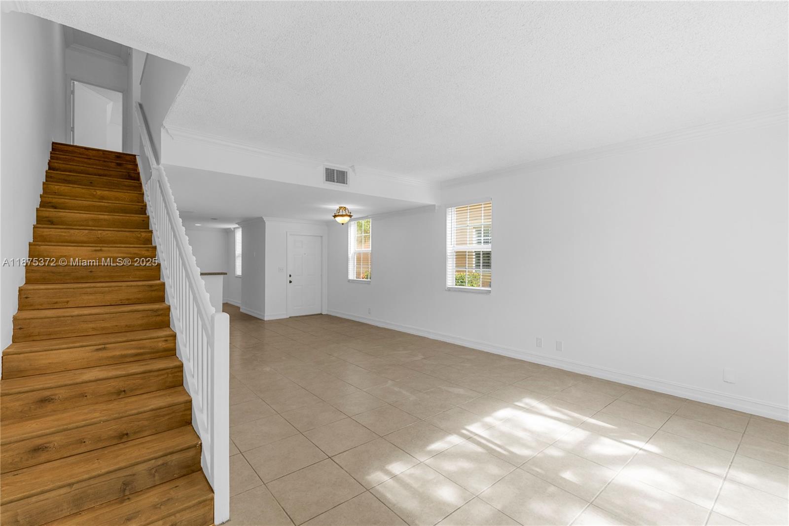 1440 Coronado Road, Unit 138 Weston, FL 33327 - Photo 9 of 38 a view of entryway with wooden floor