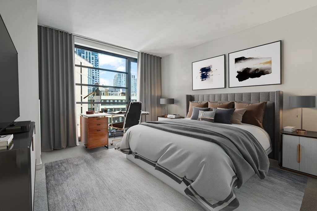 580 Washington Street, Unit 12E Boston, MA 02111 - Photo 7 of 12 a bed room with a bed and a window