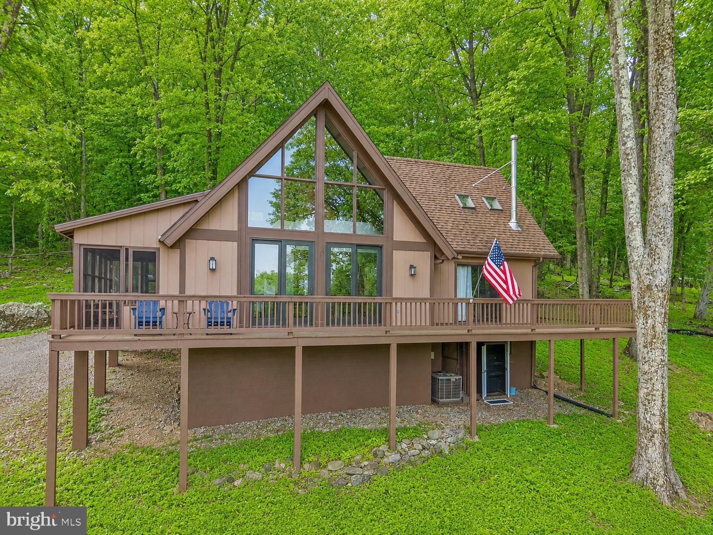 758 Club House Road Front Royal, VA 22630 - Photo 1 of 50 a view of a house with a yard and sitting area